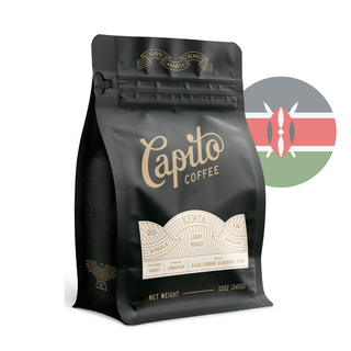 A black coffee bag labeled "Capito Coffee" with details about its light roast, single origin from Kenya, and notes of honey, black currant, blueberry, and plum. To the right, there's a faded circle with the Kenyan flag inside. The bag weighs 12oz (340g).