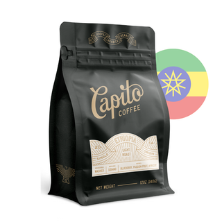  A black bag of Capito Coffee labeled "Ethiopia" with details on single-origin, light roast, and flavor notes of blueberry, passion fruit, and apricot. The net weight is 12 oz (340g). The Ethiopian flag is partially visible in the background.